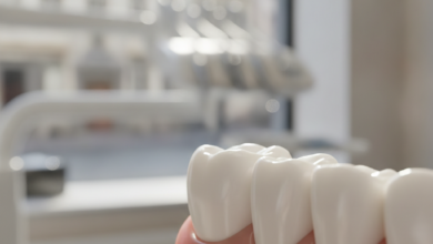 A detailed, close-up view of a pristine, white dental crown perfectly fitted onto a molar tooth. The background is a soft, out-of-focus blur of a modern dental clinic interior, with a faint, indistinct hint of a European urban street through a window.