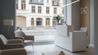 A photorealistic image of a sleek, contemporary dental clinic interior in Belgium, featuring an ergonomic dental chair or consultation desk. Through a large, blurred window, a traditional European street with Belgian architectural elements is visible in the background, symbolizing dental care costs in Belgium.