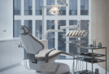 A close-up, photorealistic image of a sleek, ergonomic dental chair and advanced dental instruments meticulously arranged on a tray in a sterile, modern treatment room. Soft, cool lighting illuminates the scene, and the background is a blurred view of a contemporary urban building, subtly hinting at a Belgian city. There is no text or branding visible.