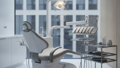 A close-up, photorealistic image of a sleek, ergonomic dental chair and advanced dental instruments meticulously arranged on a tray in a sterile, modern treatment room. Soft, cool lighting illuminates the scene, and the background is a blurred view of a contemporary urban building, subtly hinting at a Belgian city. There is no text or branding visible.
