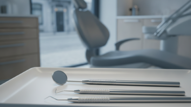 A photorealistic close-up of sterile dental instruments on a clean white tray in the foreground. The background is softly blurred, showing abstract shapes that suggest scattered euro coins and paper bills, conceptually representing hidden financial costs. Behind these, a very indistinct urban European street scene is visible through a window, implying a location like Belgium. The lighting is clean and professional.