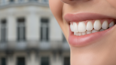 Close-up, photorealistic image of a flawless, radiant, natural-looking smile with bright, perfectly aligned teeth. The background is softly blurred, subtly suggesting classic European architecture in Antwerp, creating a sophisticated and clean aesthetic.